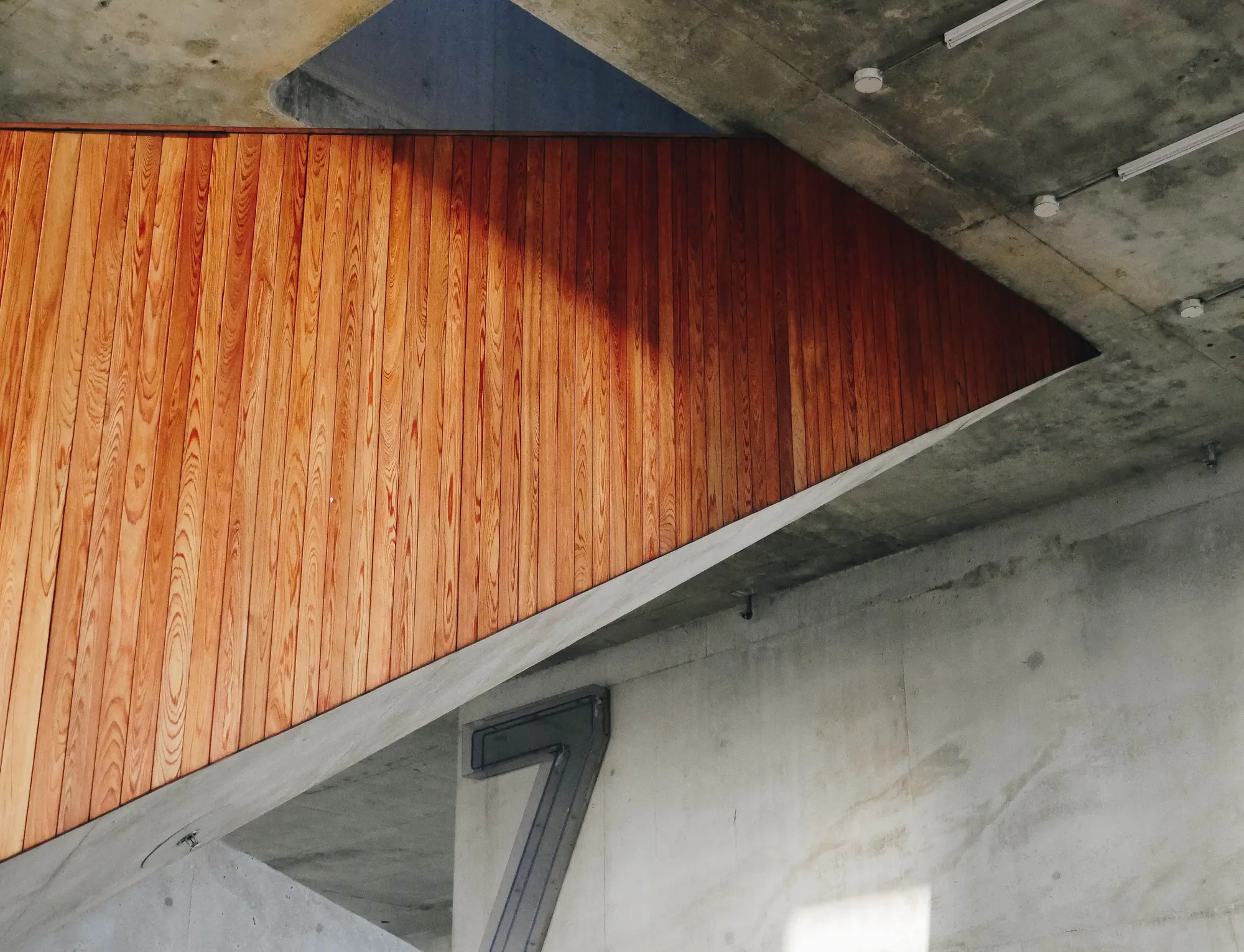 Staircase soffit in teak cladding